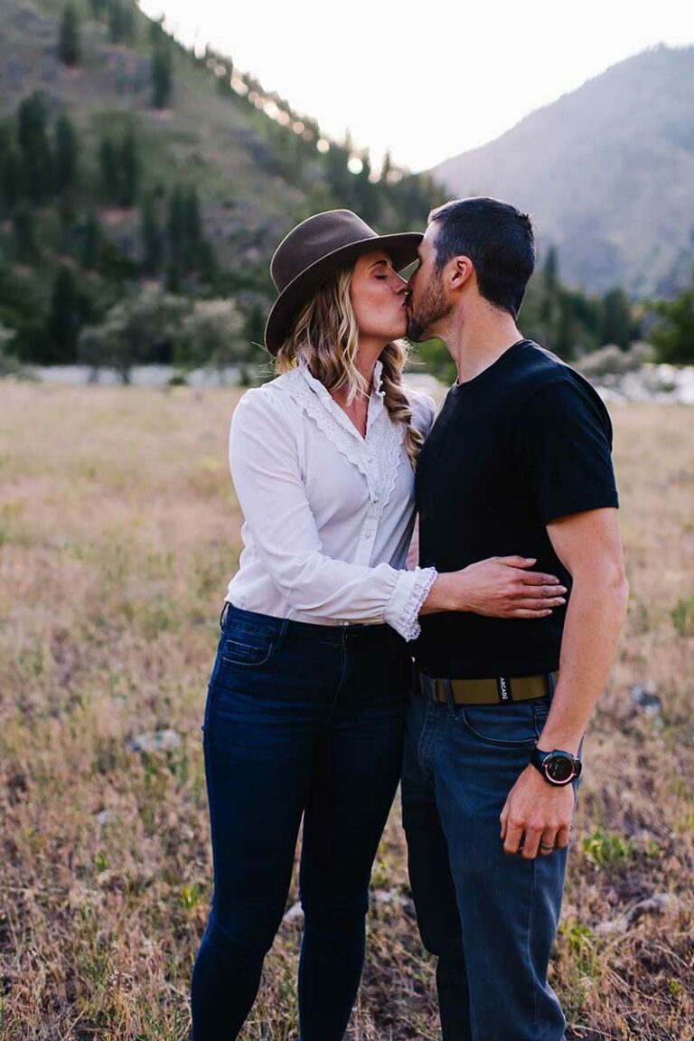 Adventurous Wedding Couple Kissing Before Sunset