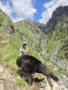 Joni with her trophy black bear at Mackay Bar Ranch